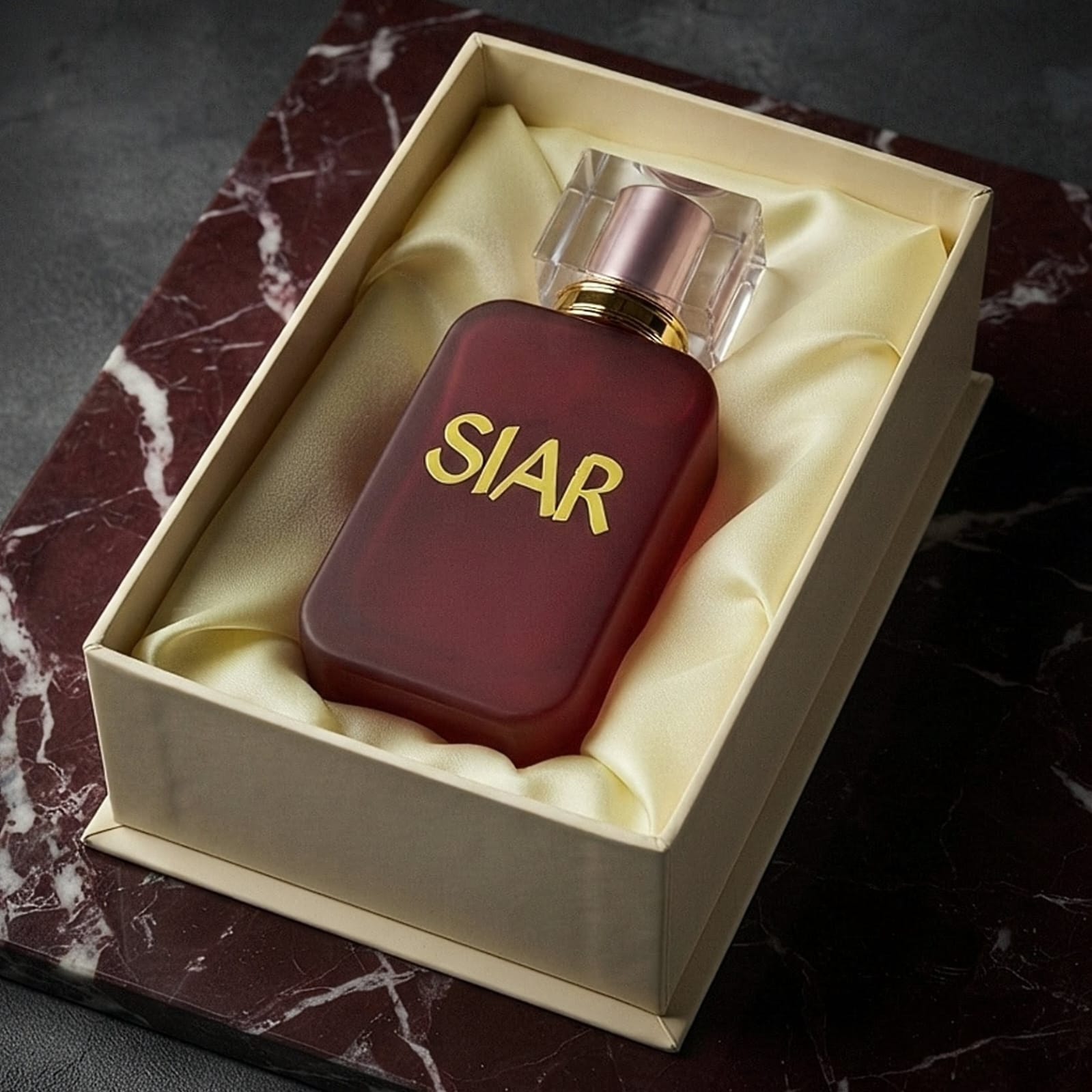 Siar Official SIAR Velvet perfume bottle laid inside its box, showcasing elegant packaging and luxurious design.